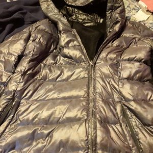 Navy blue coat with leopard print on it